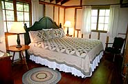 [Oakland House cottage bedrooms have charm and comfort.]
